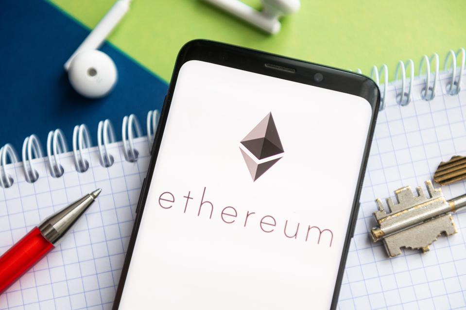 In this photo illustration, a Ethereum logo seen displayed...
